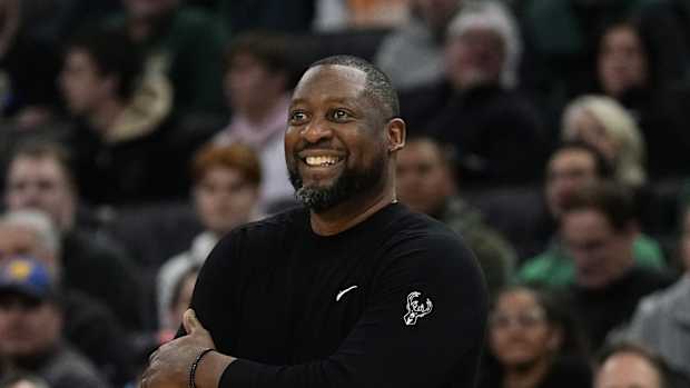 Milwaukee Bucks head coach Adrian Griffin smiles 